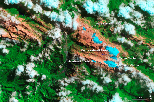 This image, captured by the Thematic Mapper (TM) on Landsat IV and Landsat V, shows Indonesia's tropical glaciers in 1989 as five ice masses on the slopes of Puncak Jaya, a 4,884-meter (1,620-foot) peak within the Sudirman Range. By 2009, two of the glaciers — Meren and Southwall — were gone. The other three—Carstenz, East Northwall Firn, and West North Wall Firn—had retreated dramatically. NASA Earth Observatory image created by Jesse Allen and Robert Simmon
