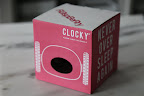 Well, hello!  What' s this?  A Clocky?  It says 'Alarm Clock On Wheels' - Hmmm - I'm getting an idea.