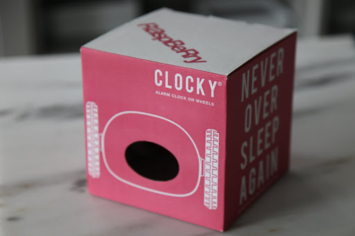 Well, hello!  What' s this?  A Clocky?  It says 'Alarm Clock On Wheels' - Hmmm - I'm getting an idea.