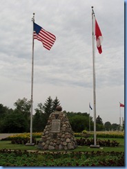 2358 North Dakota USA & Manitoba Canada - International Peace Garden - cairn of native stone right on border