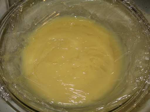 Classic Vanilla Pudding covered with plastic wrap directly against the pudding.