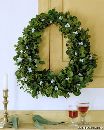 Traditional mistletoe is used in a new way by molding it into a wreath.