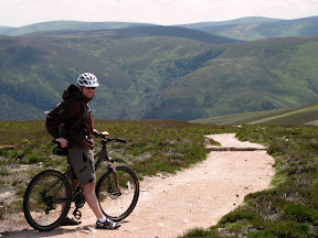 after the descent, there are about a dozen sporadically-placed stone storm drains in the trail.  apparently a lot of bikers try jumping them and damage their tires or rims.  todd and i are pretty casual mountain bikers.  todd even caught me walking my mountain bike over a curb in town and had to laugh.  even though there was probably little risk of us jumping these storms drains anyway, after those warnings, we were scared of risking anything even resembling a jump on these guys.  if you damage something here, it's a 20-mile walk down.