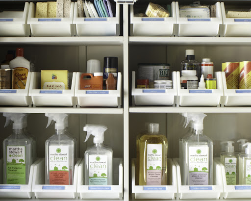 Inside, the shelving is outfitted with open front bins from The Container Store (containerstore.com). Each bin is labeled and like products are grouped together. These would also function great under a kitchen sink. Inside, the shelving is outfitted with open front bins from The Container Store (containerstore.com). Each bin is labeled and like products are grouped together. These would also function great under a kitchen sink.