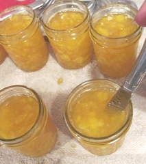 peach jam stirring the bubbles out