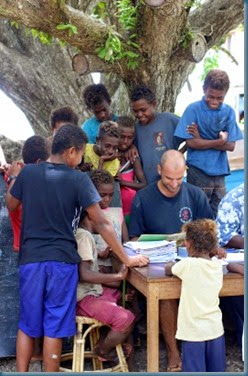 Aaron reading Lavukaleve to kids