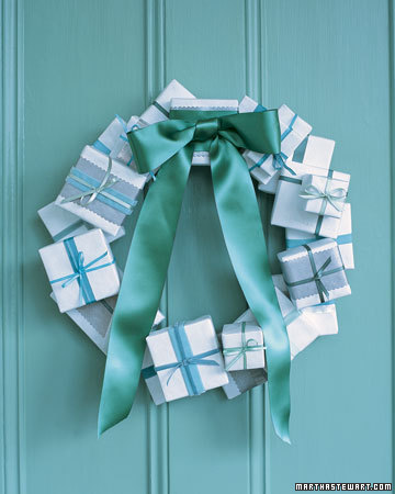 Wrap small boxes to create this festive wreath. Change the colors of the wrapping and ribbon to go with your own home's decor. Wrap small boxes to create this festive wreath. Change the colors of the wrapping and ribbon to go with your own home's decor.