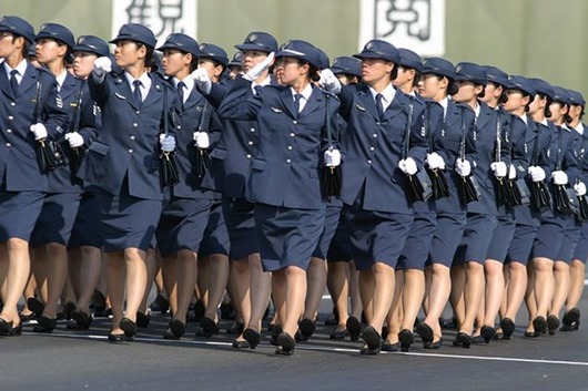 Female soldiers of the Japan Air Self-Defense Force salute their chief, Prime Minister Junichiro Koizumi during the annual military parade and review at the Ground Self-Defense Force Asaka training site in Niiza, Saitama Prefecture. This annual event had special meaning this year in that it marked the 50th anniversary of the founding of the Japan Self-Defense Force. In addressing the troops, PM Koizumi said that Japan will make it’s Self-Defense Forces a more streamlined military better at combating terrorism and the proliferation weapons of mass destruction.