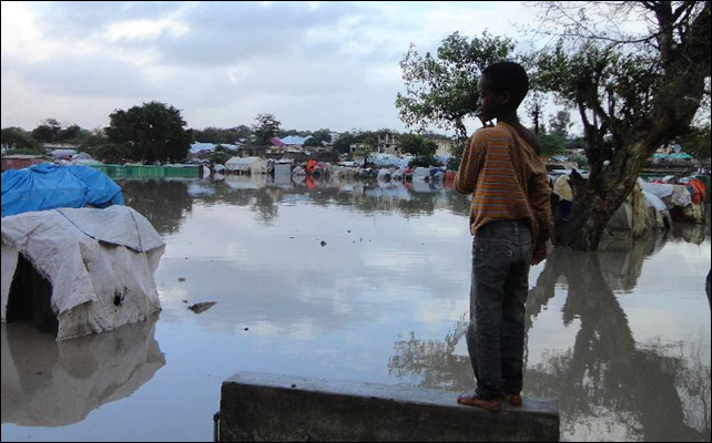 A Somalian internally displaced child looks at a flooded section of a camp in Mogadishu on 4 August 2012, following heavy rain and flash floods. Photo: Abdurashid Abdulle / AFP A Somalian internally displaced child looks at a flooded section of a camp in Mogadishu on 4 August 2012, following heavy rain and flash floods. Photo: Abdurashid Abdulle / AFP