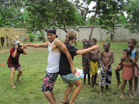 Johan and Kendall demonstrating how to walk with a water balloon between your back.