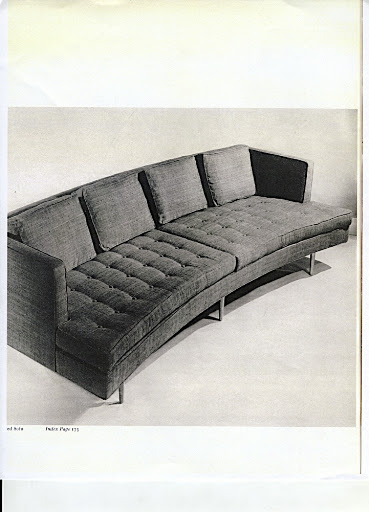 A 1950s curved sofa by Dunbar. A 1950s curved sofa by Dunbar.