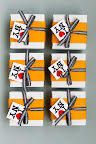 Another great favor: Black and white cookies (a New York classic) in boxes inspired by a New York taxi cab from One Girl Cookies.
