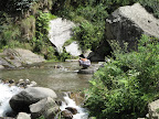 Swimming below the waterfall
