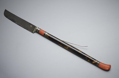 Knife | Origin:  Turkey | Period: 18th-19th century  Ottoman period | Details:  Not Available | Type: Handle: tortoiseshell, red coral, metal inlay; blade: steel | Size: H: 1.2  W: 20.2   D: 0.8  cm | Museum Code: F1990.25 | Photograph and description taken from Freer and the Sackler (Smithsonian) Museums.
