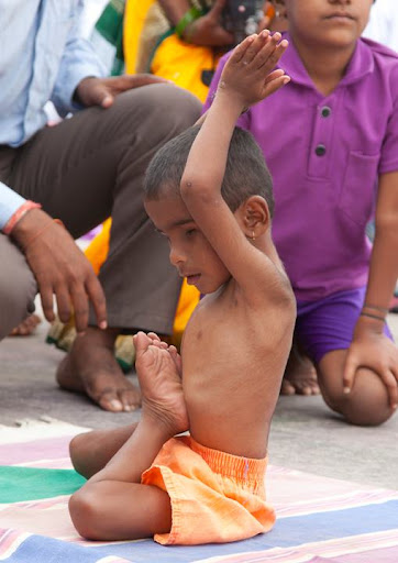 4. This small and undernourished looking child has no eyes. There is no possible health reason for being put in such a knee-jerking posture, especially at this young age.