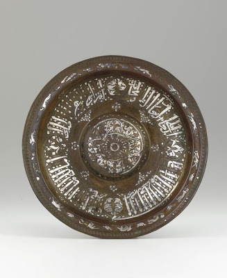 Plate | Origin:  Egypt | Period: mid-14th century  Mamluk period | Details:  Not Available | Type: Brass, inlaid with silver and gold | Size: H: 3.2  W: 28.9  cm | Museum Code: F1953.89 | Photograph and description taken from Freer and the Sackler (Smithsonian) Museums.