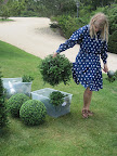 Naomi starts to arrange the garden ceremony site.