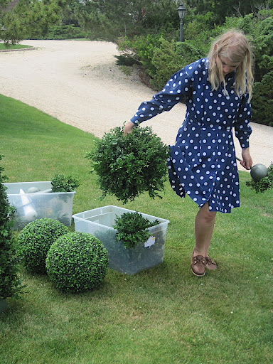 Naomi starts to arrange the garden ceremony site.