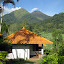 Our small bungalow with Penangungan in the background