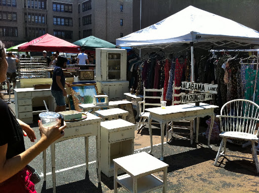 An entire area of the flea market was cleared to make room for this white, distressed furniture.