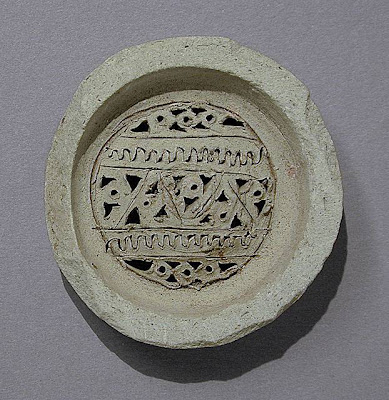 Jar Filter Western or Central Iran Jar Filter Ceramic; Vessel, Terracotta, Height: 9/16 in. (1.4 cm); Diameter: 2 5/16 in. (5.8 cm) Gift of Jerome F. Snyder (M.80.202.229) Art of the Middle East: Islamic Department.