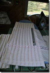 Tucking the flounce into the pleating board, pressed and cooled.
