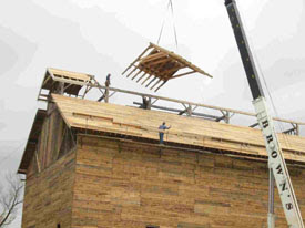 Flying in roof sections.  This photo came from the VYCC web site.