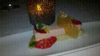 panna cotta at Lola: blood orange and vanilla bean panna cotta layer was on a thin slab of clove cake and topped with mint and citrus dessert, Michael Symon