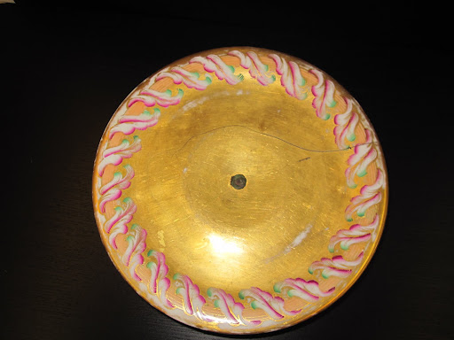 I love the glow to this piece and the pink and green colors compliment the style and texture of the cake stand.