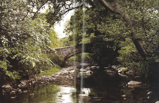 This calm creek resting under this old stone bridge is nothing short of enchanting.