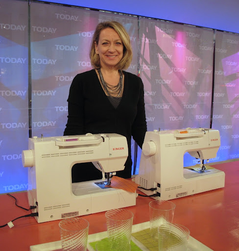Here is Becky with the two machines we used to embroider coasters.
