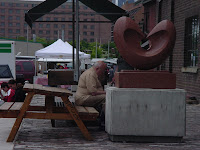 Distillery District: Toronto, June 2004: Man overpowers bench
