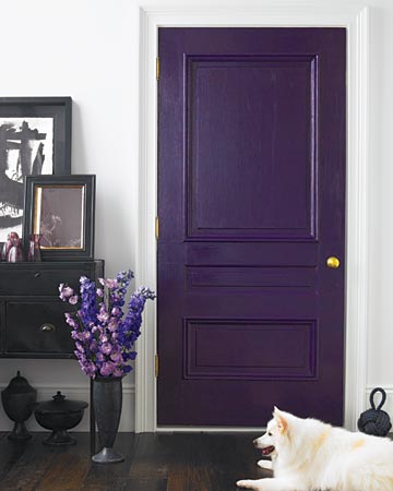 Winter: Although dark-purple walls might be difficult to live with (and hard to paint over), a deep-violet door creates intrigue without overpowering this entryway. The marriage of purple paint and dark wood floors also looks surprisingly classic. The door can be painted over when this darker tone seems too harsh.