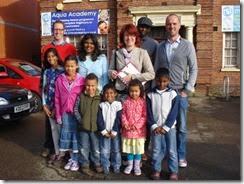 small Rob White (left), Priya, Beata, John Josh Williams (right) and children outside Arthur Hill