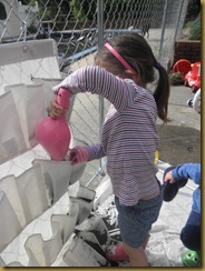 Sophia and Cohen planting herb garden