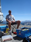 Nathan settles in for a bit on the col.. not a bad spot for some sunbathing..