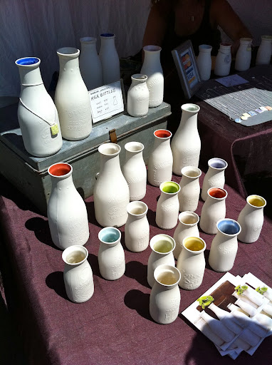 Painted, vintage milk bottles make beautiful vases. Painted, vintage milk bottles make beautiful vases.