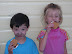 Kai (with charcoal on his face) and Alex enjoying s'mores