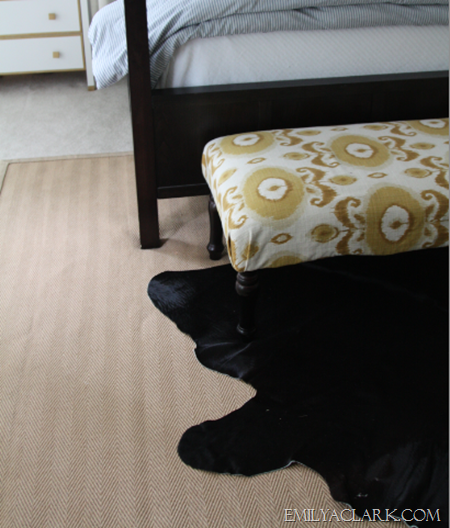 black cowhide rug in bedroom