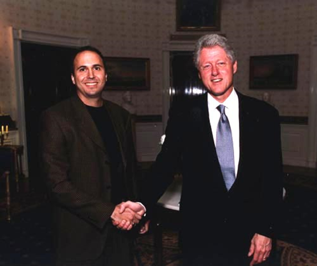 Dr. Andrew Dessler shakes hands with U.S. President Bill Clinton. Dr. Dessler served as a Senior Policy Analyst in the White House Office of Science and Technology Policy for the last year of the Clinton administration. Photo: atmo.tamu.edu