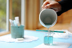 Step 7: Pour the colored wax into the candleholder slowly.