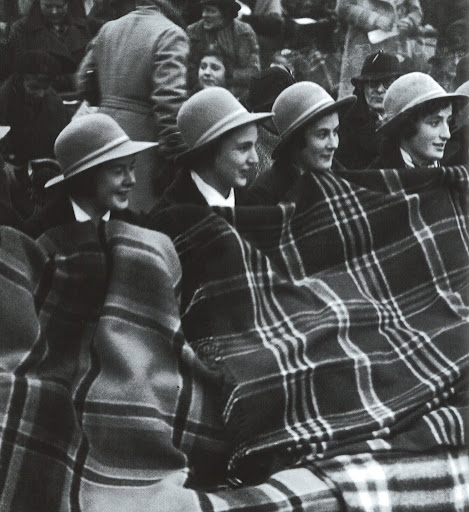 Tartan teamwork -- Tartan rugs give warmth to a group of English schoolgirls who are spectactors at a ladies' hockey match in Surrey 1936. Tartan teamwork -- Tartan rugs give warmth to a group of English schoolgirls who are spectactors at a ladies' hockey match in Surrey 1936.