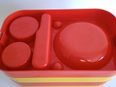  orange and yellow Ingrid stacking plastic picnic tray set