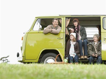 Family looking out from camper van. United Kingdom