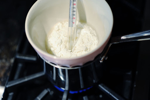 Step 2: Place the thermometer inside the bowl, and heat the wax until it reaches 180 degrees.