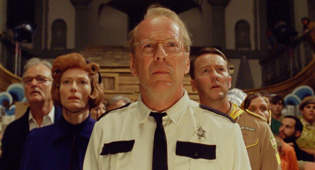 (l to r.) Bill Murray as Mr. Bishop, Tilda Swinton as Social Services, Bruce Willis as Captain Sharp, Edward Norton as Scout Master Ward, and Frances McDormand as Mrs. Bishop in Wes Anderson’s MOONRISE KINGDOM, a Focus Features release.  
Credit:  Focus Features