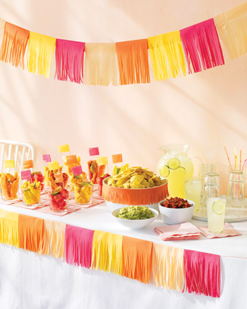 Tissue paper streamers make for vivid table settings. (marthastewart.com)