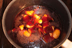Simmering wine with orange peel and cloves