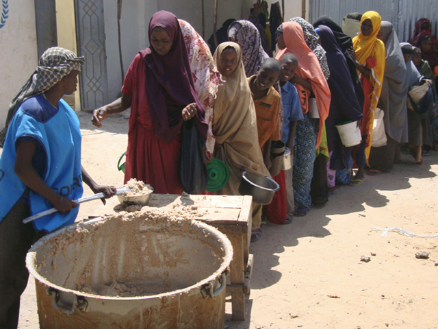 Families displaced by drought line up for food this week in Mogadishu, Somalia, 20 January 2012. AFP / AFP / Getty Images