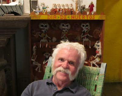 Mike in front of a Dia de Muertos display